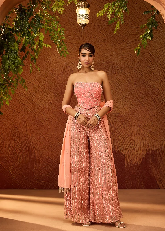Party dress with a midi length -Charvi Peach and Pink Corset Gharara Set with Dupatta Party dress with a midi length -Charvi Peach and Pink Corset Gharara Set with Dupatta